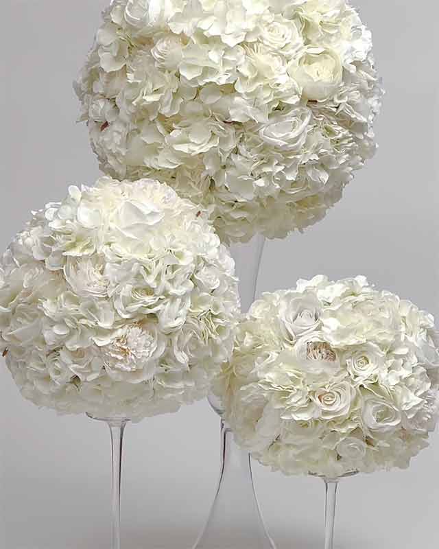 Up close details of the Lovely White Floral Centerpieces in medium and large